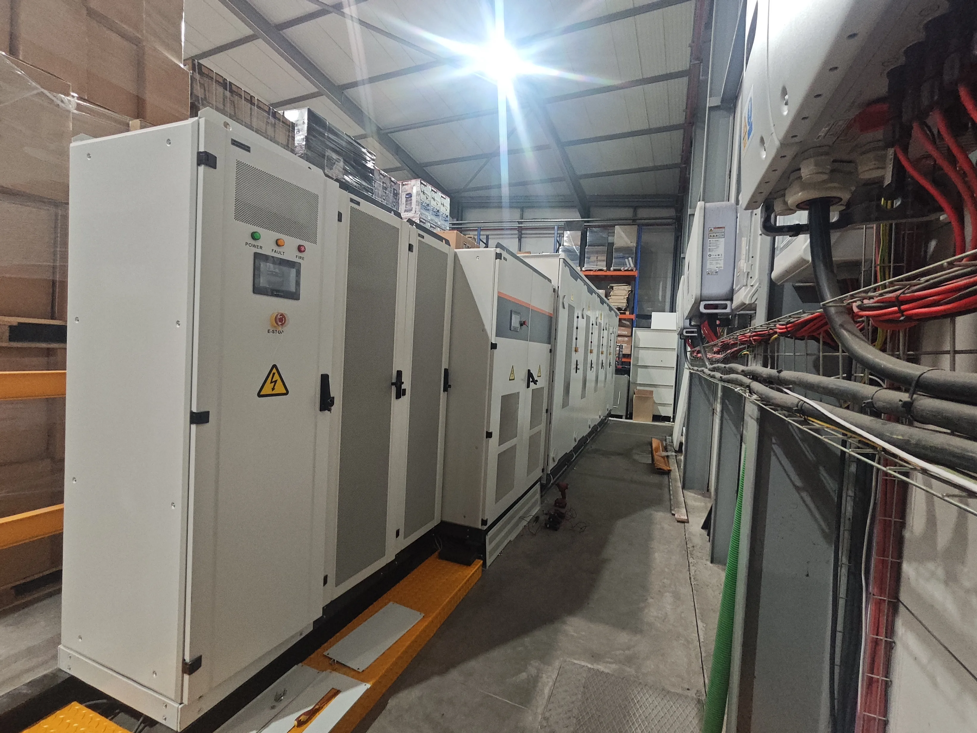 Utility-scale grid frequency regulation energy storage containers